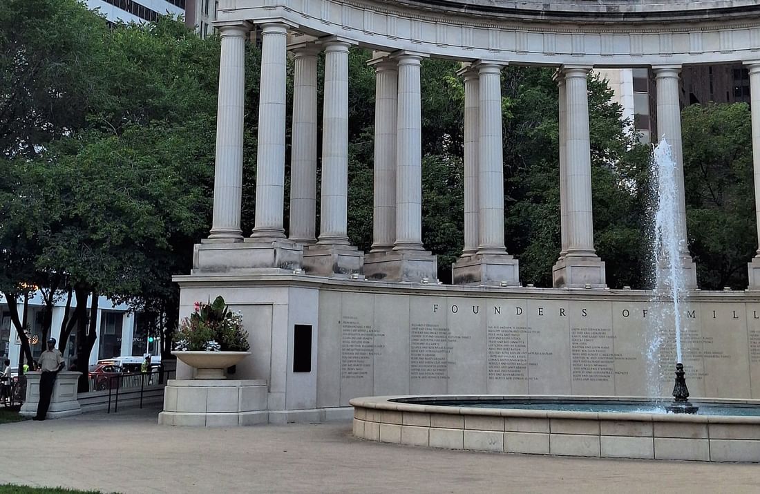 Founders of Millennium Park monument and fountain with high-rise buildings in background near Warwick Allerton Chicago