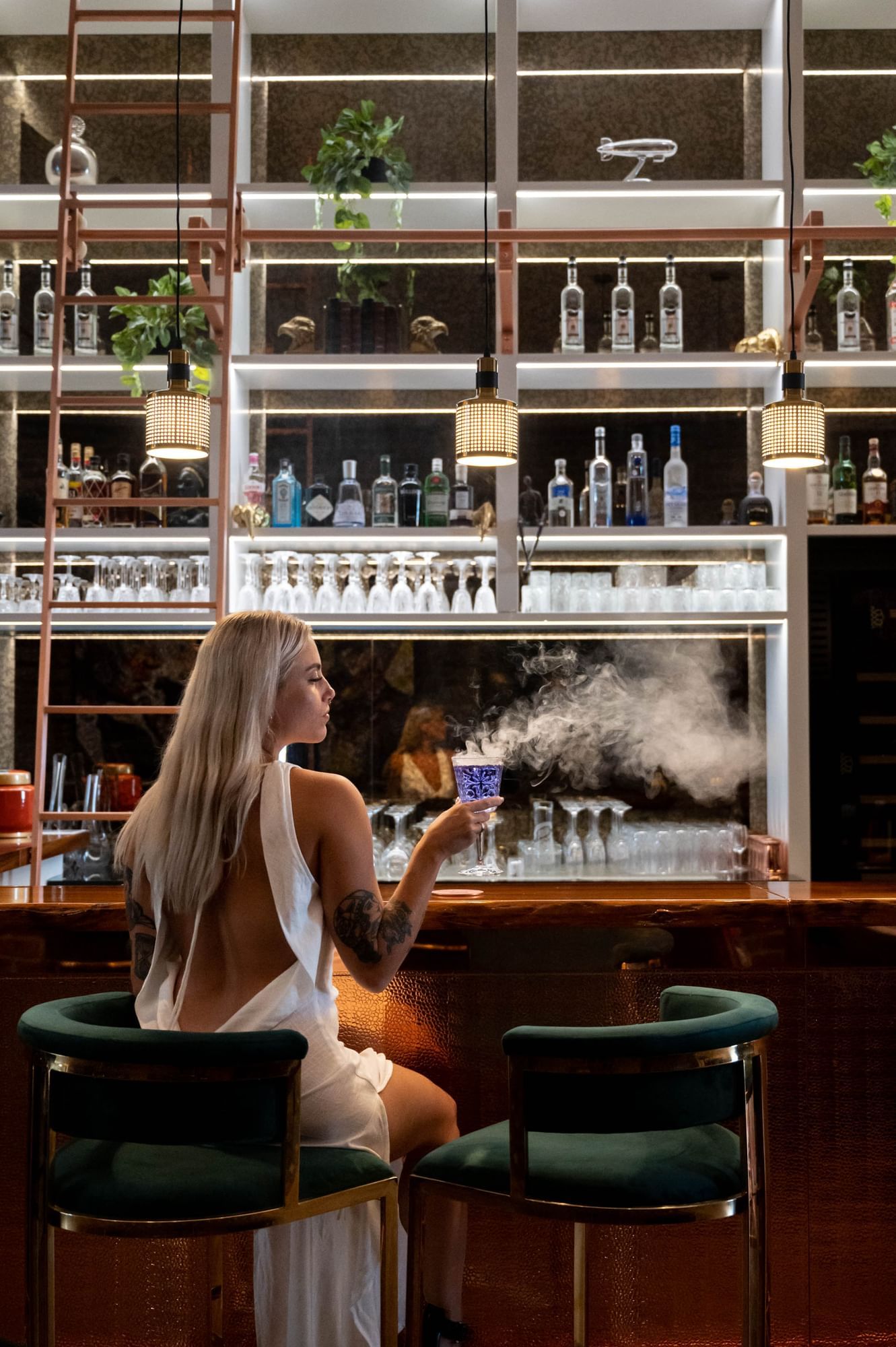 Girl by the bar counter in Melrose Bar & Lounge at Paramount Hotel Midtown