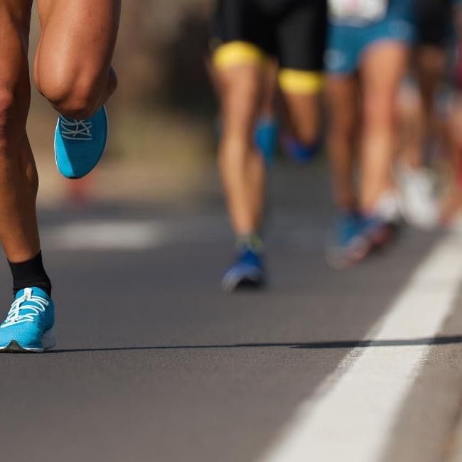 Close up Runners in a marathon race for Endure24 Reading.
