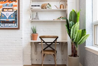 Workspace with shelf & plants in Superior Loft at Retro Suites Hotel