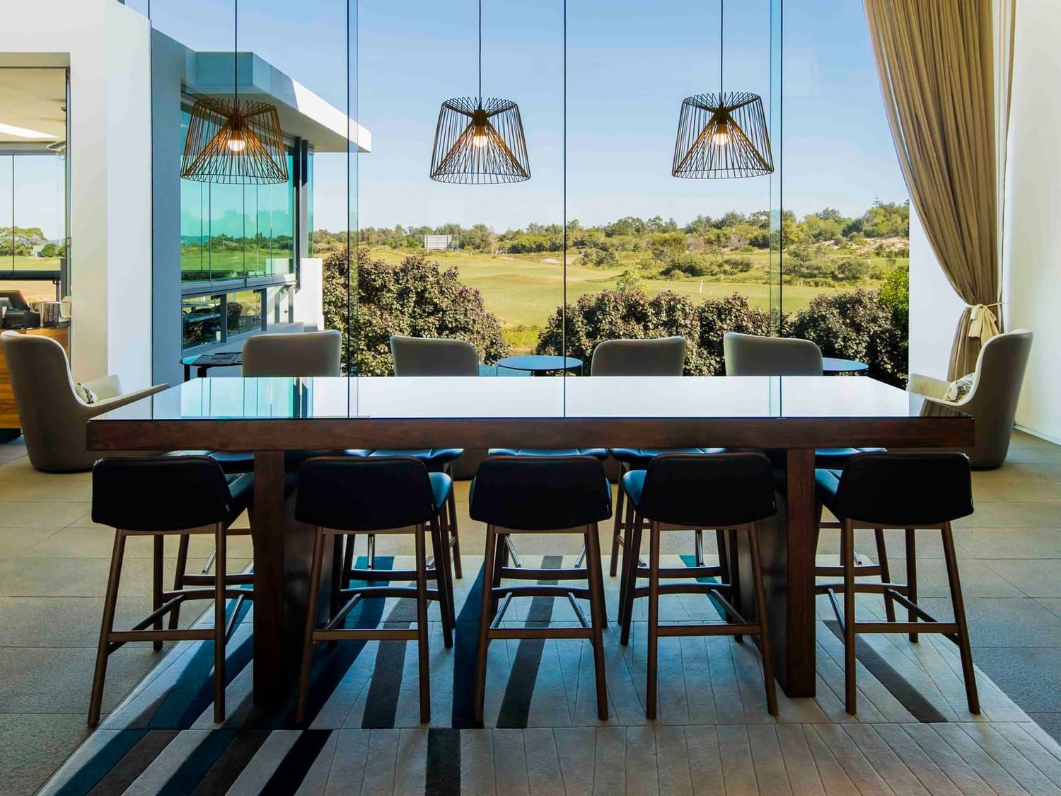 Dining table arranged by the window at Pullman Magenta Shores