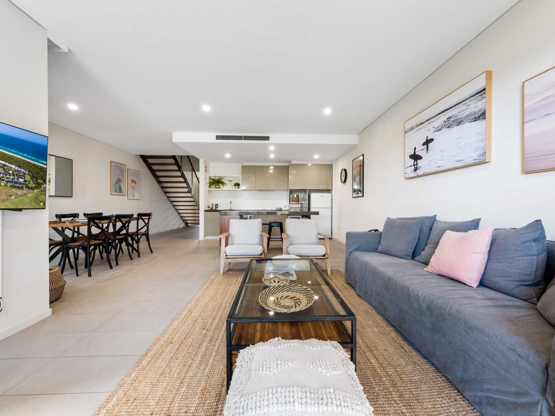 Living area with seating and carpeted floors in Deluxe Three Bedroom Villa at Pullman Magenta Shores