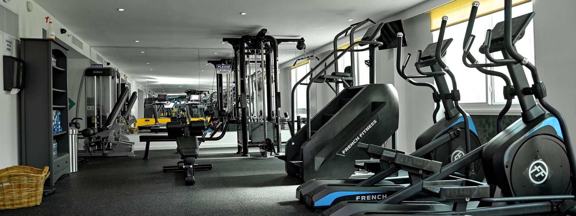 Multiple exercise machines including treadmills and weight machines in gym at Warwick Paradise Island - Bahamas, Nassau.