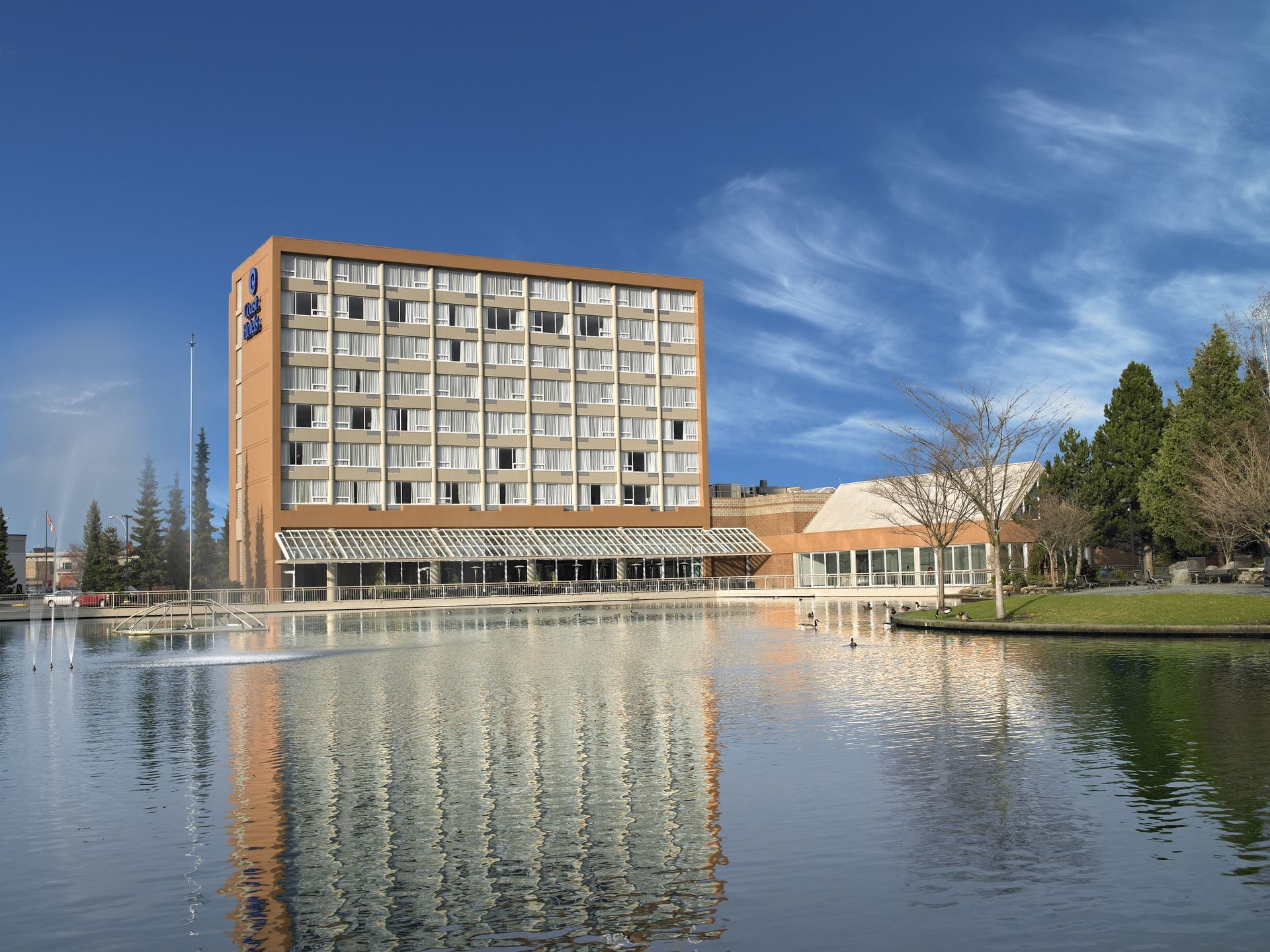 Pond and exterior of Coast Chilliwack Hotel by APA