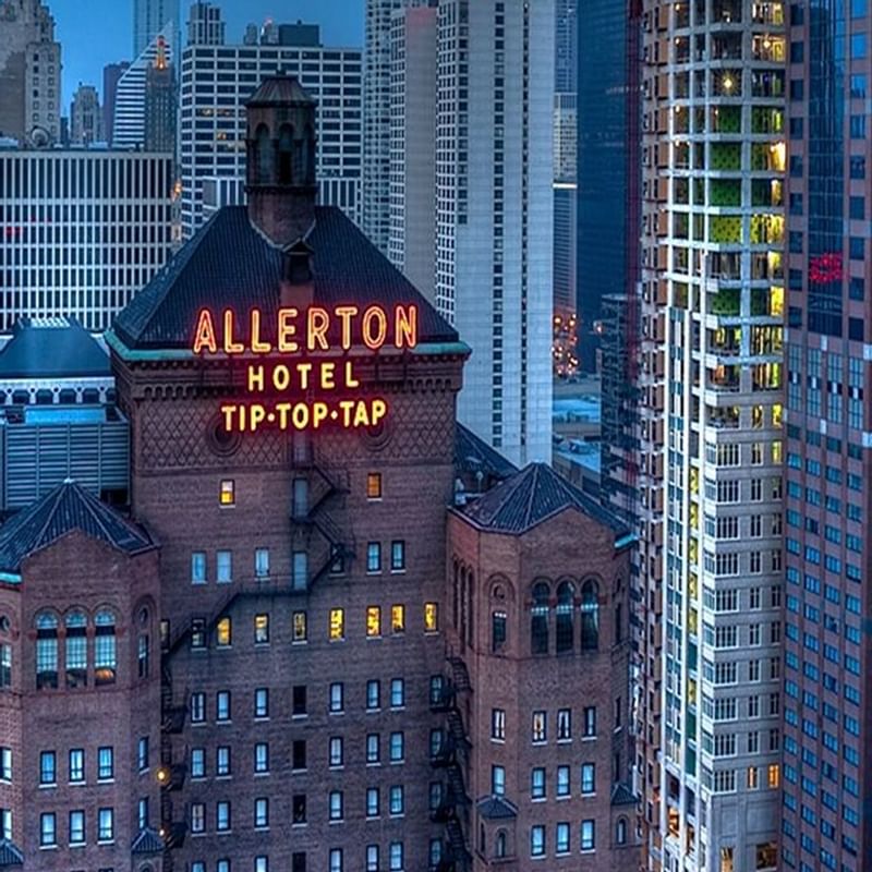 High-angle shot of Warwick Allerton - Chicago Hotel's neon sign at night