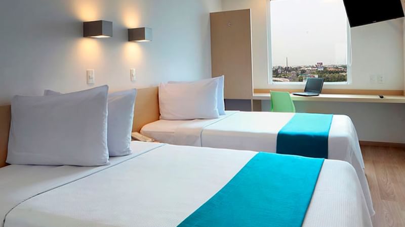 Interior view of Superior Room with two twin beds at One Hotels