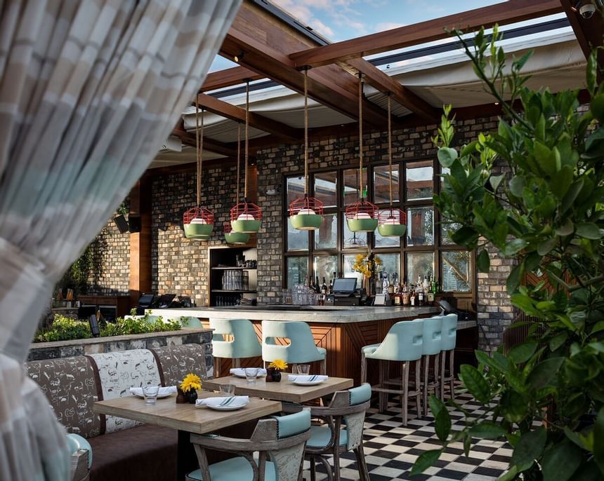 Tables &chairs in Grill bar morning preview at Dream Hollywood