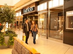 Couple shopping at CF Chinook Centre near Carriage House Hotel