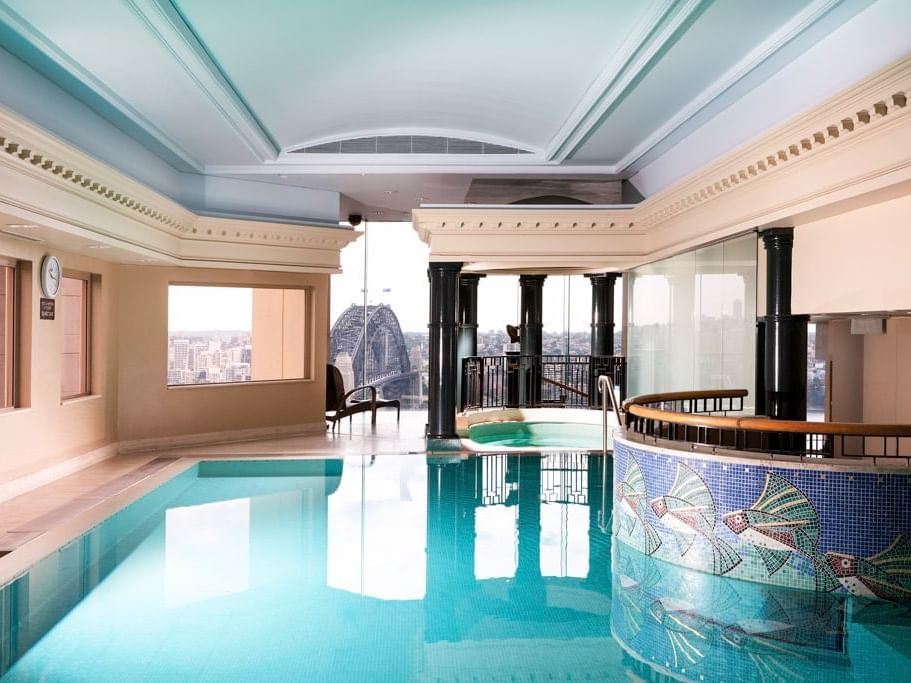 Pool area with city view at The Sebel Quay West Suites Sydney