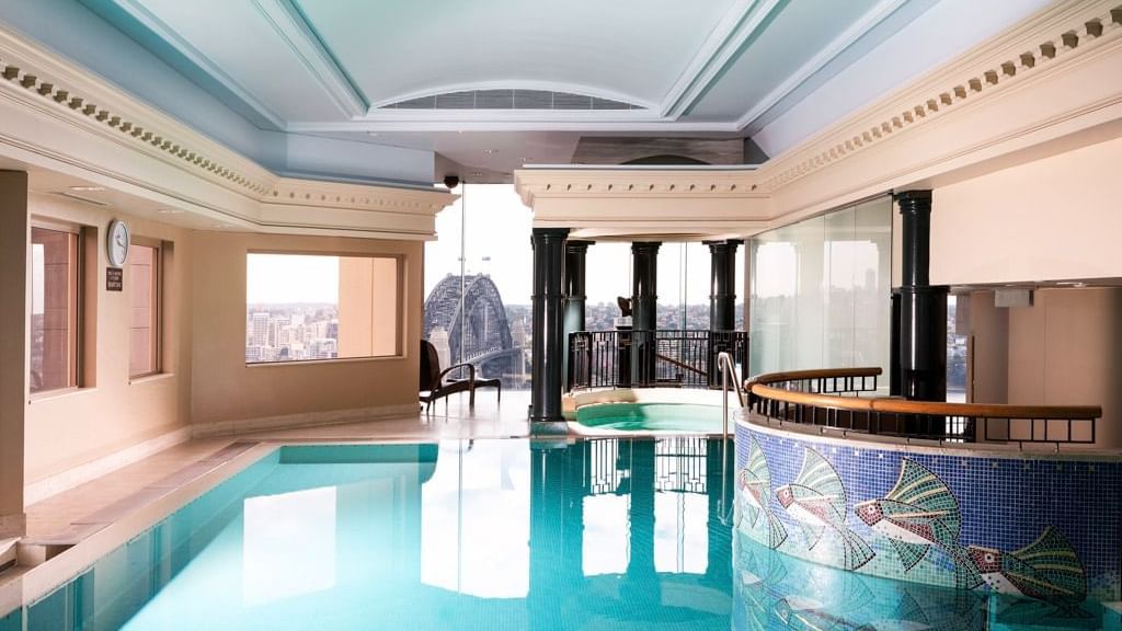 Pool area with city view at The Sebel Quay West Suites Sydney