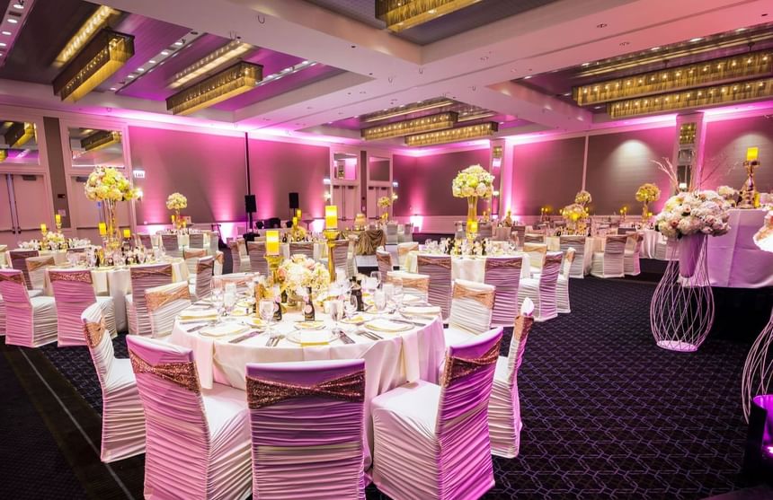 a ballroom with pink lights