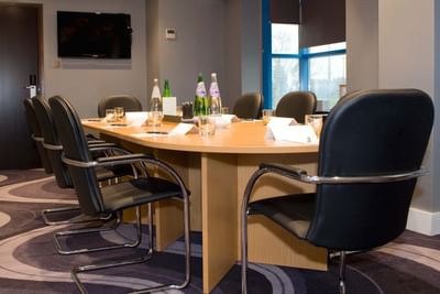 A hall prepared for a meeting at the Sandman Signature London Ga