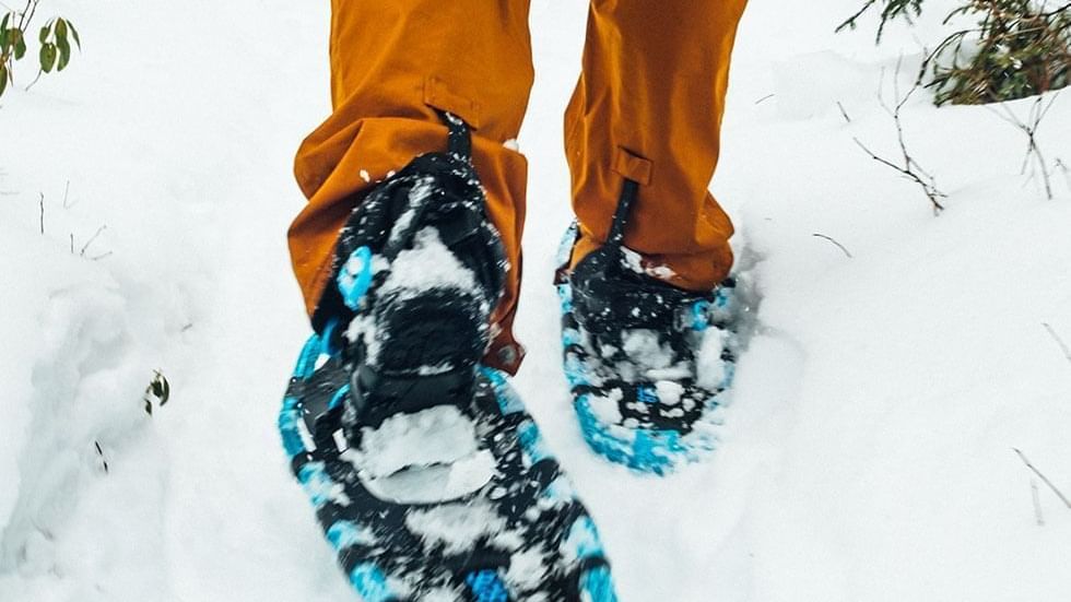 Close-up of snowshoes of a hiker near Falkensteiner Hotels