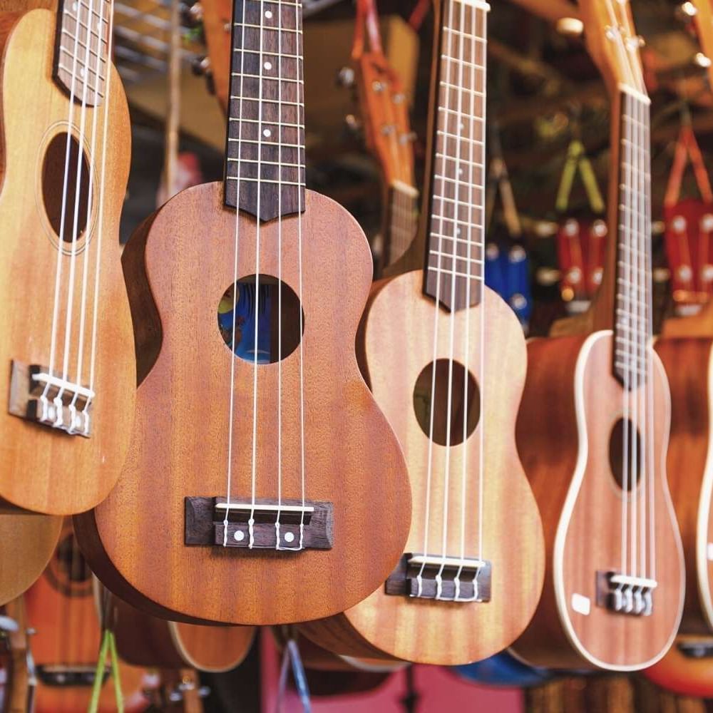 Guitar collection hung in a local shop near Waikiki Resort Hotel by Sono