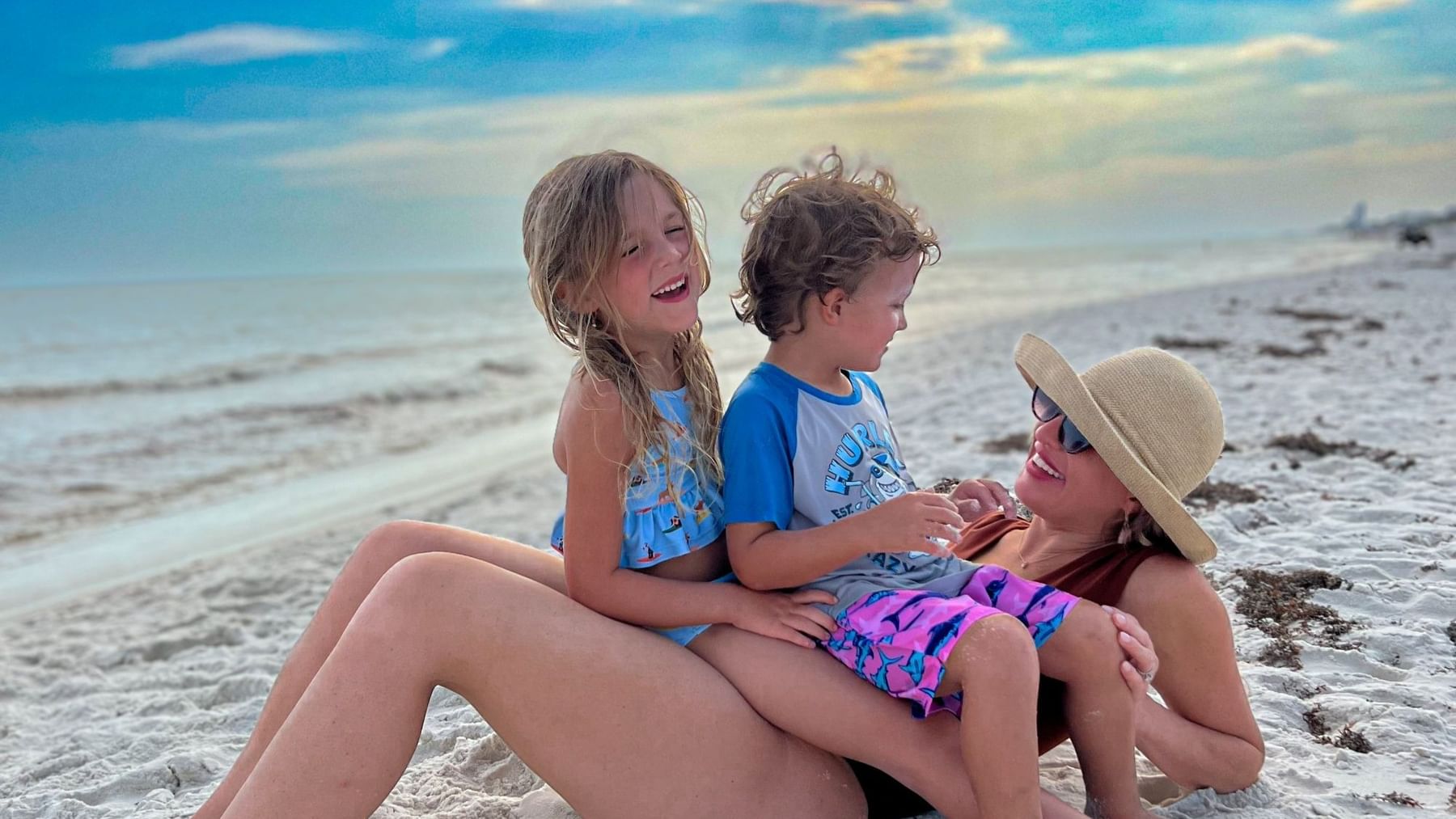 Mother and two kids on the beach on 30A at Watersound Inn.