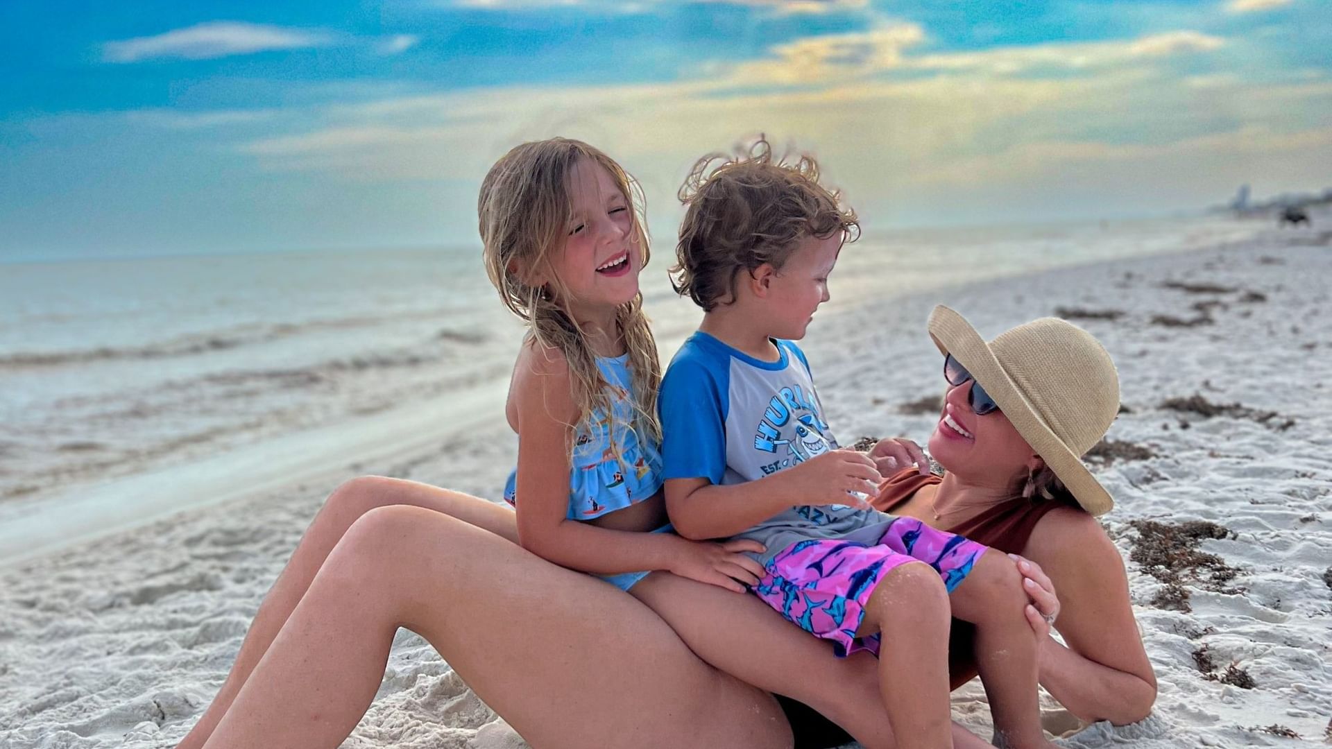 Mother and two kids on the beach on 30A at Watersound Inn.