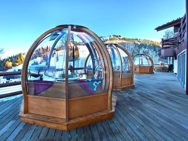 Exterior of Alpenglobes on a wooden deck in Stein Lodge