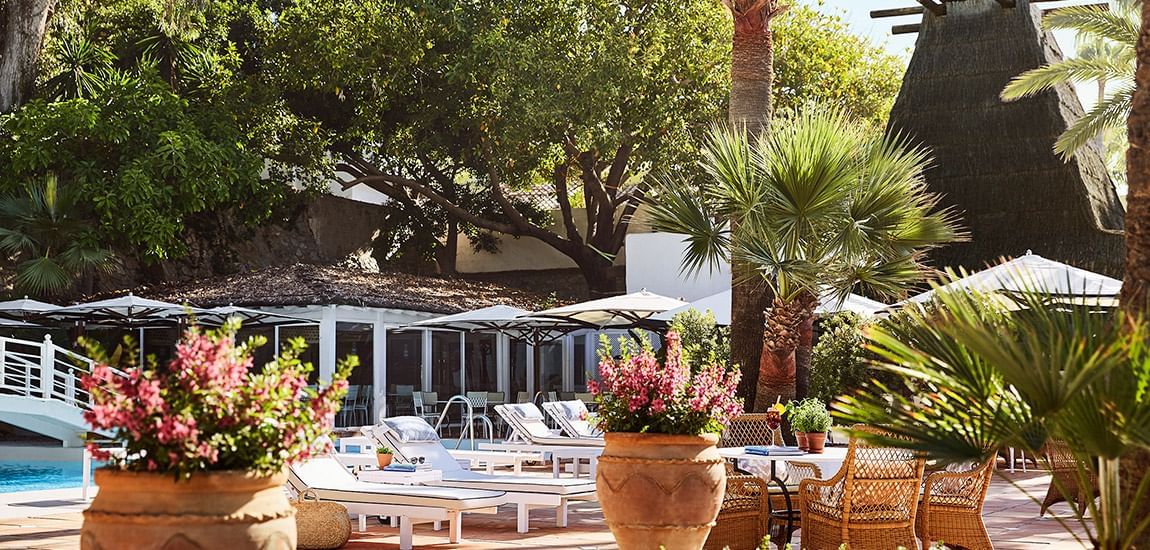Sun lounges near the outdoor pool at Marbella Club Hotel