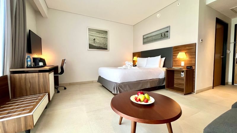 Junior Suite at Fiesta Inn Express Cancún Cumbres with TV facing bed, & round coffee table, family friendly hotels in cancun