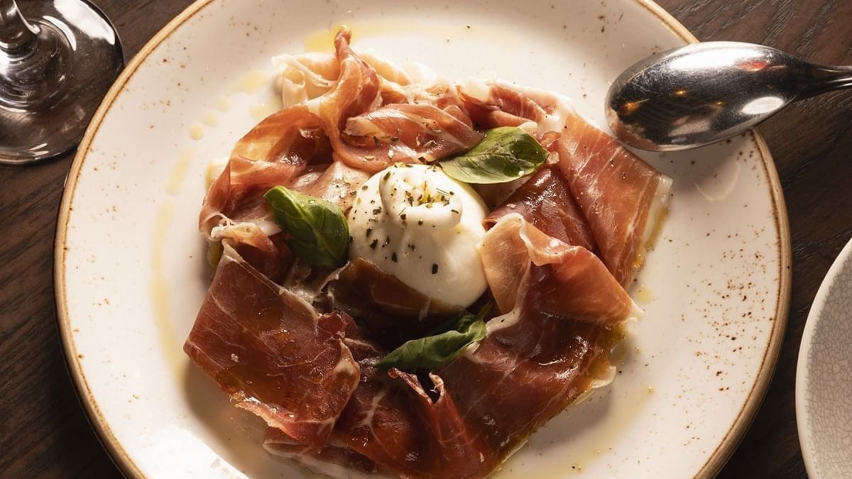 Burrata cheese with prosciutto served in Di Francesco Cucina Restaurant at Crown Hotel Melbourne
