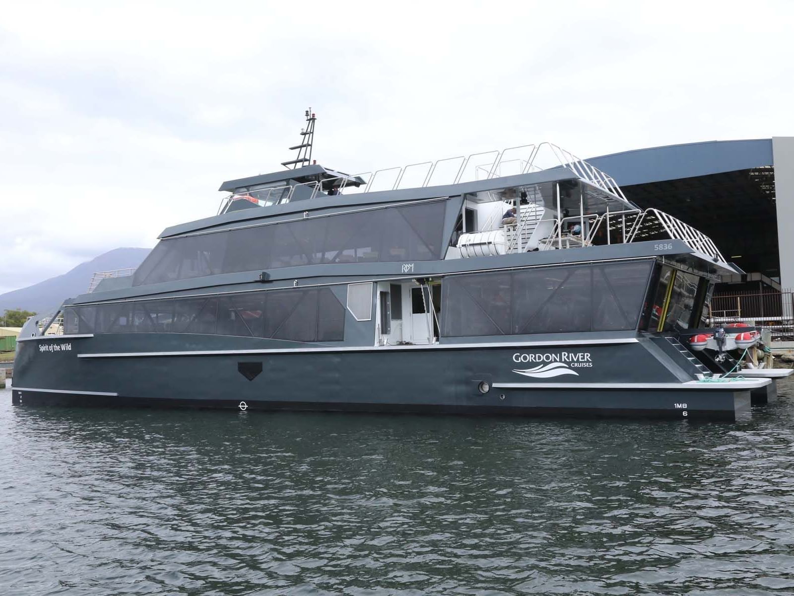 A Vessel parked by the deck at Gordon River Cruise