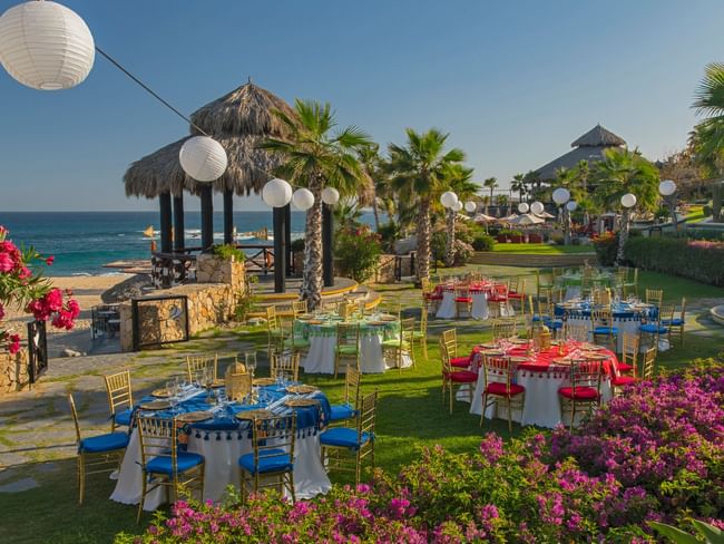 Palapa Fiesta Dinner Reception with colorful tables and chairs at Hacienda del Mar Los Cabos