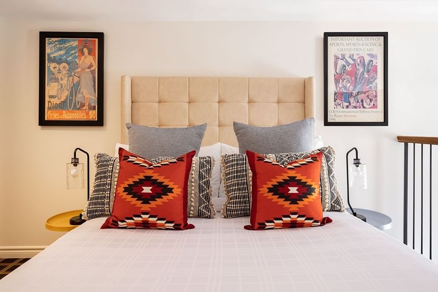 Cozy king bed, nightstands & wall pictures in Superior Loft at Retro Suites Hotel