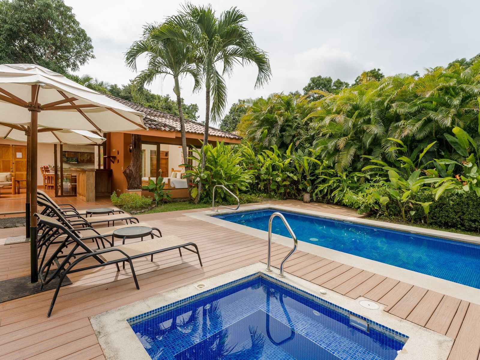 Sunbeds by the pool in Golf 2 Villa at Punta Islita Hotel