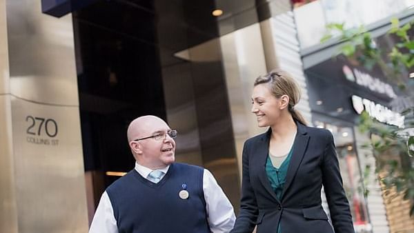 Staff posing at the entrance of Novotel Melbourne on Collins