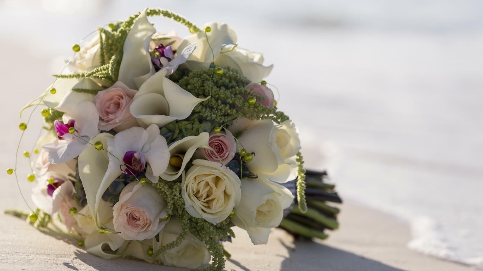 Close-up of a bouquet on a beach near Live Aqua Resorts