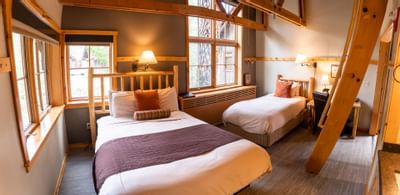 Twin beds with the main floor in Loft at Sleeping Lady