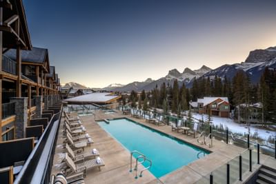 Balcony view of The Malcolm Hotel surrounded by mountains