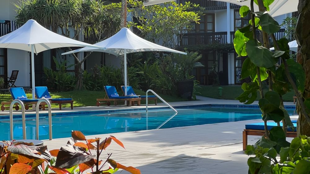 Blue loungers by adult-only pool and bar at Warwick Fiji Resort and Spa in Korolevu.