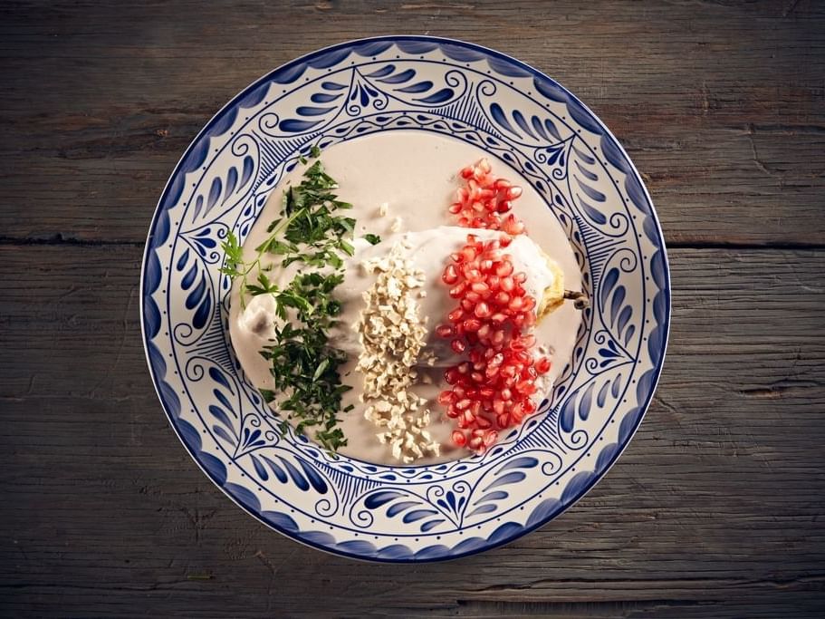 Close-up of Chiles en nogada served at Gamma Hotels