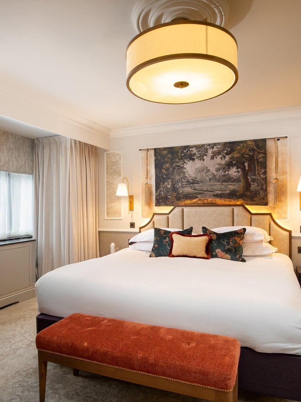 Elegant suite with a large bed and modern decor at The Capital Hotel, Apartments & Townhouse