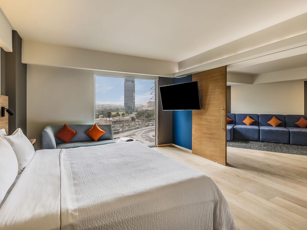 Cozy with Comfortable Couch and wooden flooring in Junior Suite at Fiesta Inn