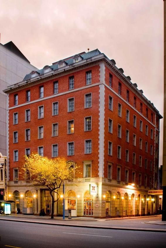 Exterior front view of the hotel entrance & the street at Hotel Grand Chancellor