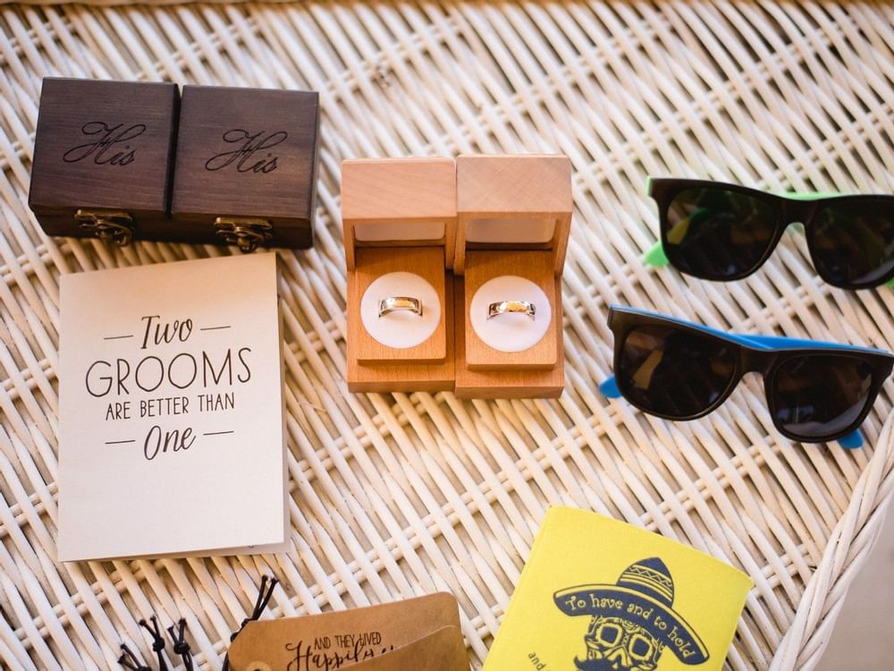 Wedding rings and shades on table at Fiesta Americana hotels