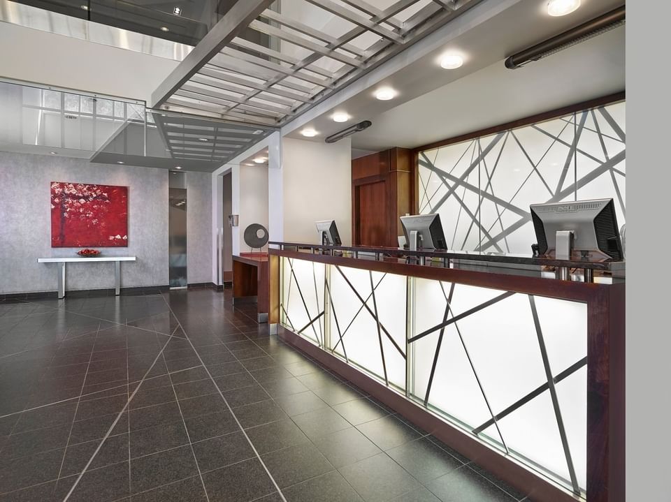 Interior of reception front desk with computers at Matrix Hotel