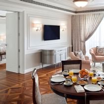 Dining & living area with a TV in Grand Suite, Palazzo Versace