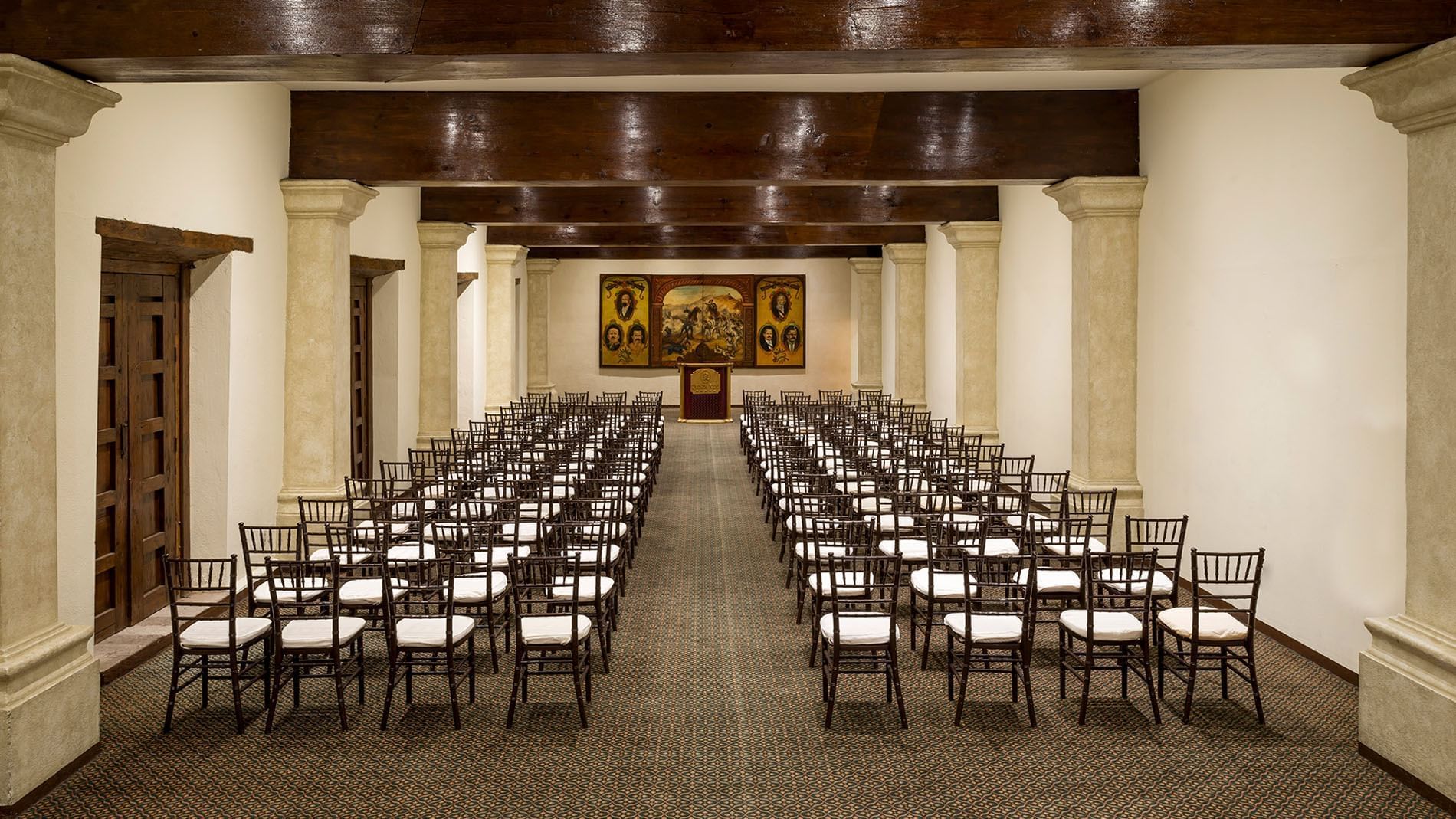 San Pedro arranged for a presentation with rows of chairs and a podium at Quinta Real Zacatecas