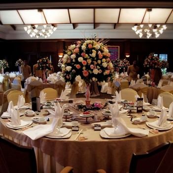 Elegant Grand Ballroom at The Saujana Hotel Kuala Lumpur with round tables and floral centerpieces