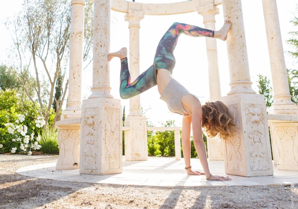 Lorem ipsum Yoga pose under Allegretto's gazebo