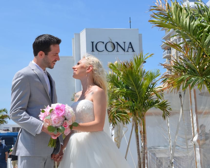 Bride and groom pose for a photo outside our Diamond Beach wedding venue