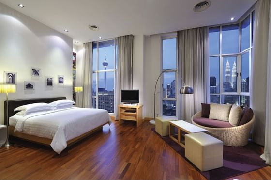 Interior of room with king bed at Federal Hotels International
