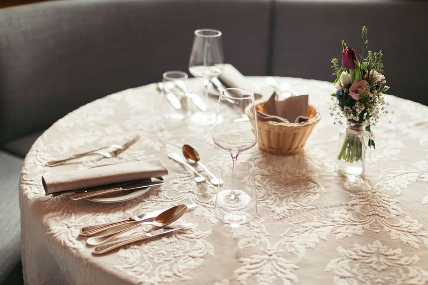 Close-up of a dining table set up in La Cascata at Liebes Rot