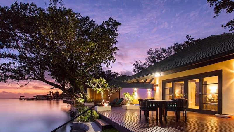 Outdoor dining in Pacific Pool Villa at Warwick Le Lagon