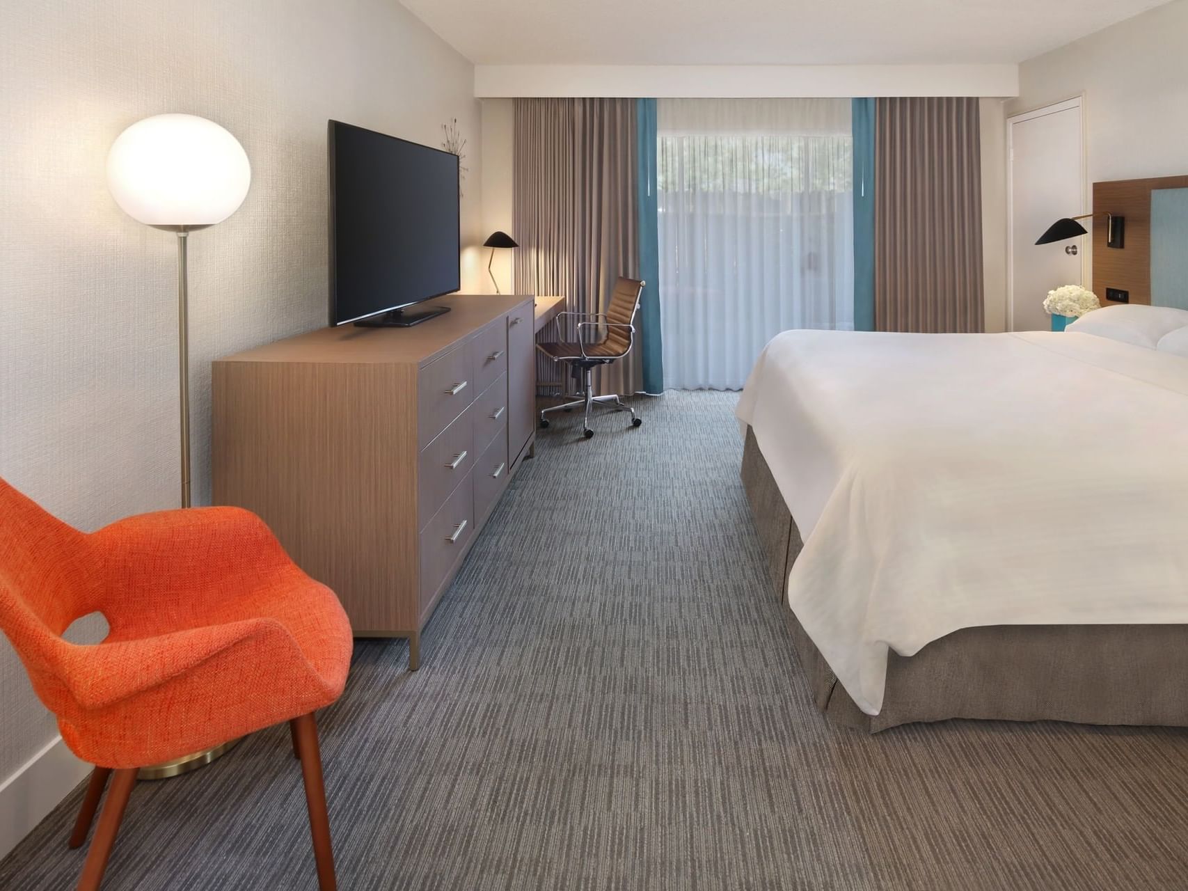 Bed, TV in Two Queen Room with a king bed at The Anaheim Hotel