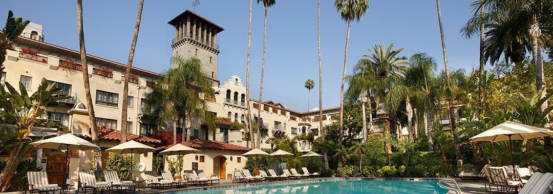 Outdoor pool with lounge chairs at Mission Inn Riverside
