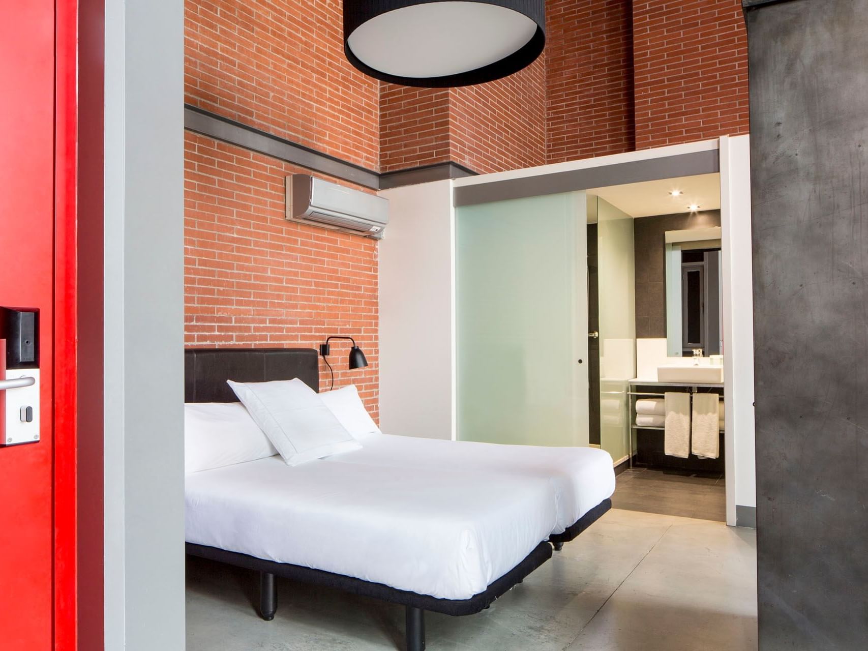 Bedroom arrangement in Deluxe room at Barcelona Apartment